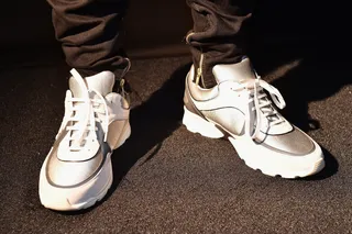 Marquise Jackson - white/silver Chanel Trainers - Marquise Jackson showed off his futuristic sporty side by wearing a pair of designer athletic sneakers courtesy of Chanel.(Photo: Paras Griffin/BET/Getty Images for BET Networks)