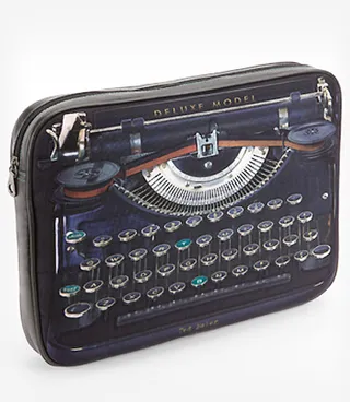Ted Baker Typewriter Laptop Sleeve - Protect what's sure to be your most expensive electronic with this vintage-meets-modern laptop sleeve.  (Photo: Courtesy Fred Flare)