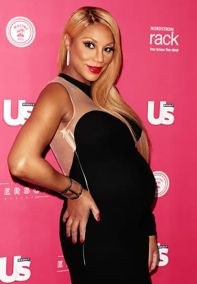 Tamar Braxton - In 2013, the Braxton Family Values star announced she was expecting on Good Morning America. The singer and reality star, who looked ravishing throughout her pregnancy, wowed audiences with her performance at BET's Celebration of Gospel and continued to tirelessly promote her single &quot;Love &amp; War&quot; until she literally could no longer walk.  (Photo: Brian To/WENN.com)