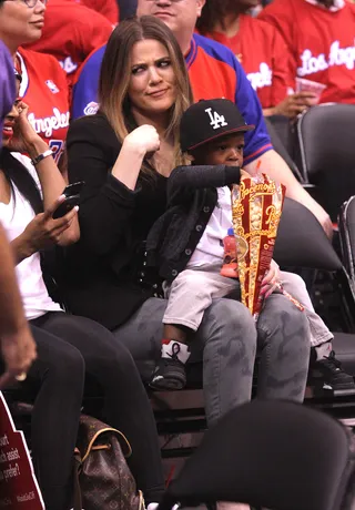 Auntie Khloe - Khloe Kardashian plays with her girlfriend's son while seated courtside at the Clippers playoff game against the Memphis Grizzlies at the Staples Center in downtown Los Angeles.&nbsp; (Photo: London Ent / Splash News)