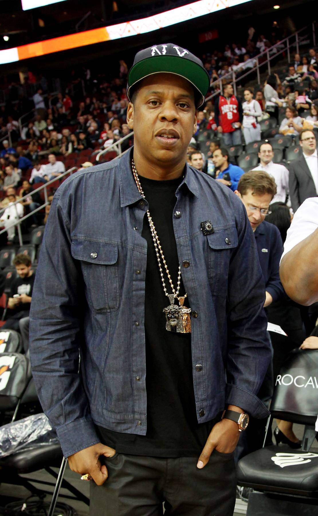 portrait of jay - z! wearing a yankee baseball hat and