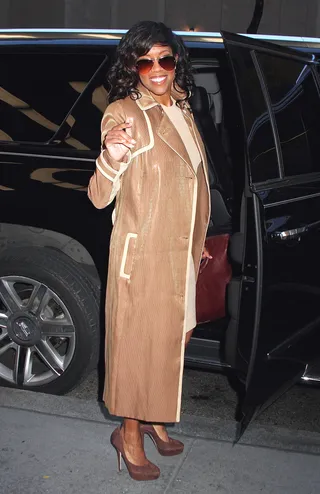 Glittering in Gold - Regina King sparkles in a metallic tan trench coat as she leaves NBC Studios in NYC's Rockefeller Center.(Photo: Fortunata/Splash News)