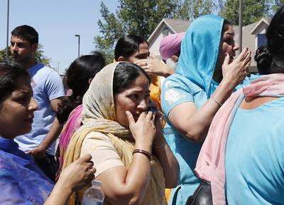Oak Creek, Wisconsin - Seven people were killed, including the gunman, after a man opened fired&nbsp;at a Sikh temple in Oak Creek, Wisconsin, on Aug. 5. Suspected shooter Wade Michael Page allegedly had ties to white supremacist groups.&nbsp;(Photo: AP Photo/Jeffrey Phelps)