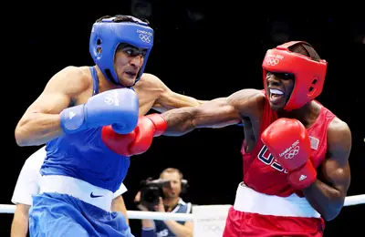 Singh Socks It to Gausha - Vijender Singh of India defeated U.S. boxer Terrell Gausha in the men's middle boxing match Thursday.&nbsp; (Photo: Scott Heavey/Getty Images)
