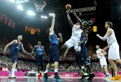 Spain Defeats Great Britain - Serge Ibaka of Spain shoots against Joel Freeland of Great Britain in&nbsp; the men's basketball preliminary round match where Spain posted a narrow win. (Photo: Christian Petersen/Getty Images)