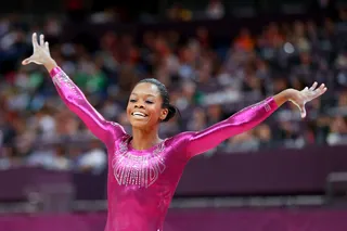 Olympic Superstar - Living up to her nickname, the "Flying Squirrel," Gabrielle Douglas, of the United States, won the individual all-around gold medal on day 6 of the London 2012 Olympic Games. BET.com takes a look at the phenom's spectacular performance.(Photo: Streeter Lecka/Getty Images)