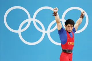 Solid Gold - Qingfeng Lin of China lifted his way to gold during the Men's 69kg Weightlifting Final. (Photo: Quinn Rooney/Getty Images)