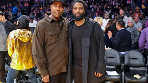 LOS ANGELES, CALIFORNIA - DECEMBER 05: Actors Denzel Washington and son John David Washington attend a basketball game between the Los Angeles Lakers and the San Antonio Spurs at Staples Center on December 05, 2018 in Los Angeles, California. (Photo by Allen Berezovsky/Getty Images)