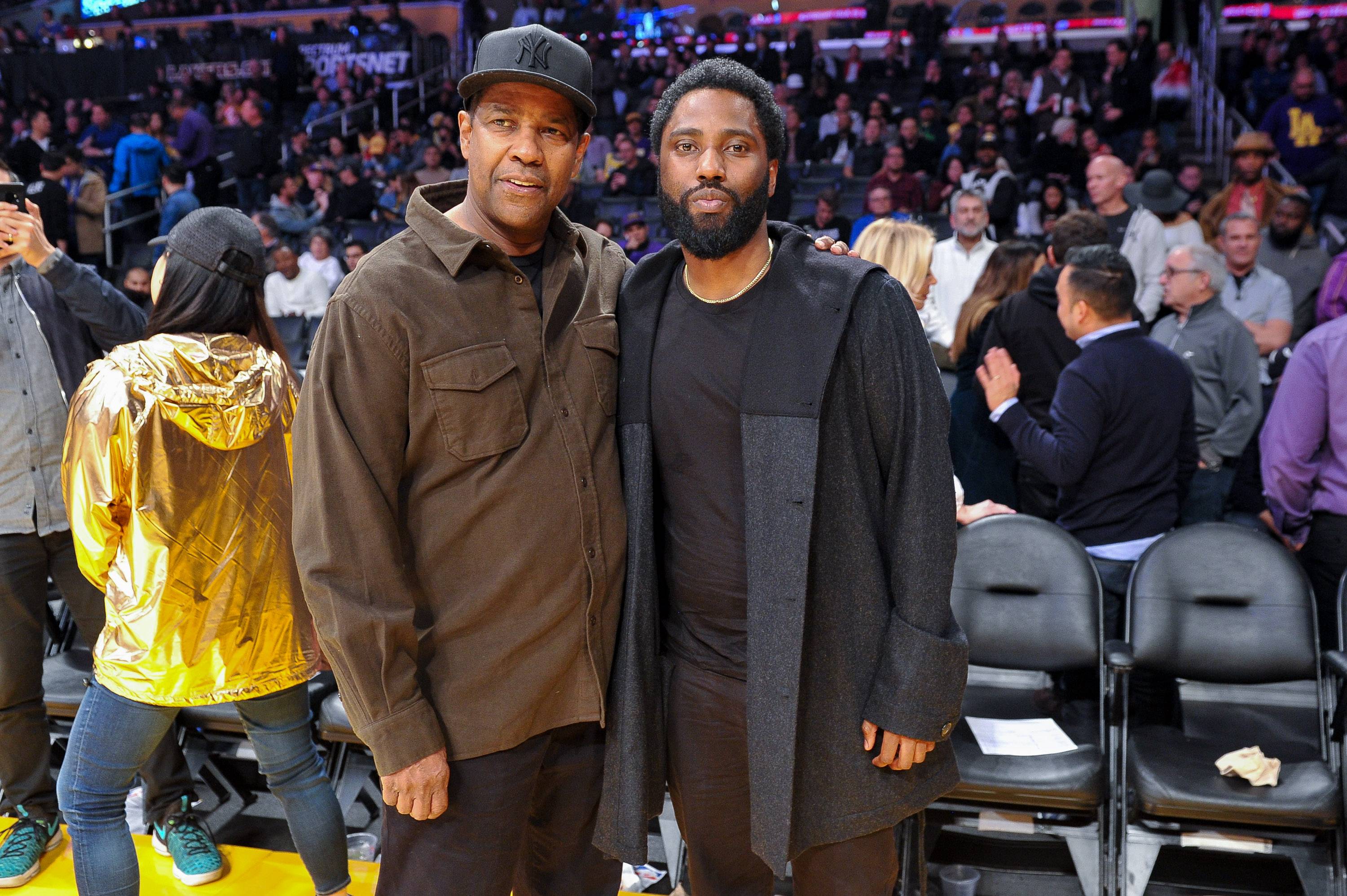 LOS ANGELES, CALIFORNIA - DECEMBER 05: Actors Denzel Washington and son John David Washington attend a basketball game between the Los Angeles Lakers and the San Antonio Spurs at Staples Center on December 05, 2018 in Los Angeles, California. (Photo by Allen Berezovsky/Getty Images)