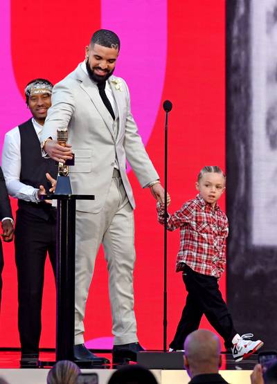 Drake And Adonis Graham - Drake’s son&nbsp;Adonis&nbsp;(3)&nbsp;caused quite a stir at the 2021 Billboard Music Awards with his fresh new kicks and neatly styled cornrows. We love that the legendary rapper and the ‘Artist Of The Decade’ recipient shared the monumental moment with his baby boy. So sweet!(Photo by Kevin Mazur/Getty Images) (Photo by Kevin Mazur/Getty Images)