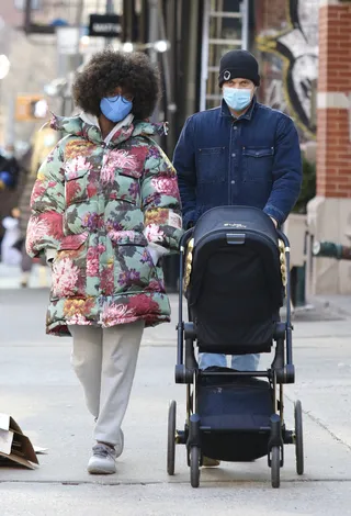 Casual NYC Stroll! - Jodie Turner-Smith and her husband Joshua Jackson take their infant daughter on a casual stroll in NYC. Jodi was cozy yet sylish in sweats and a floral Gucci x North Face coat tthatcher’s she modeled on the recent cover of Elle magazine. (Photo: Getty Images) (Photo: Getty Images)