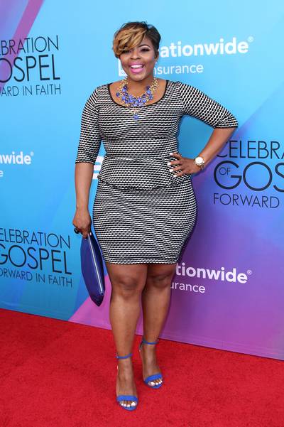 A Splash of Blue - Being Mary Jane actress Brely Evans arrived in a black and white peplum dress and a new short haricut that was complimented with her royal blue heels and clutch.(Photo: Maury Phillips/BET/Getty Images for BET)
