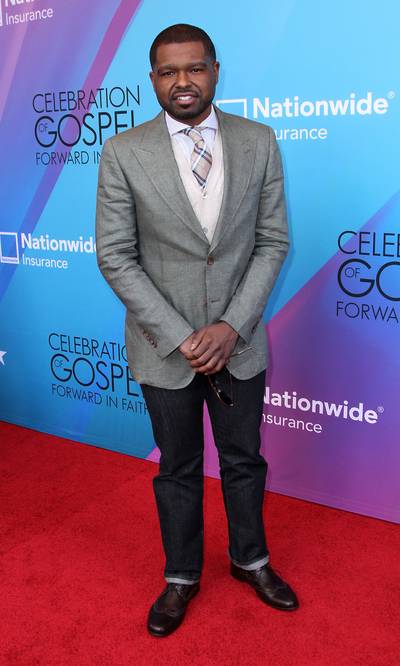 Casually Chic - Pastor Marquis Boone mixed his Sunday best with a pair of midnight blue jeans, taking a casual look up a notch. (Photo: Maury Phillips/BET/Getty Images for BET)