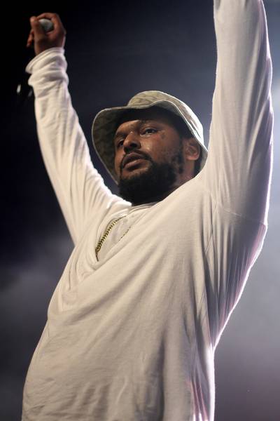 Amping Up the Crowd - Hands in the air! Although we're used to seeing him rock the stage with his Black Hippy crew, which includes Jay Rock, Ab-Soul, and Kendrick Lamar, ScHoolboy Q was just as impressive holding things down alone.(Photo: Rahav Segev/Getty Images for BET)