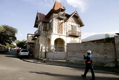 The Fight to Save Haiti's Gingerbread Homes - The Haitian nonprofit Knowledge &amp; Freedom Foundation has teamed up with local craftsmen to restore dozens of “gingerbread houses,” architectural gems that went unscathed during the devastating 2010 earthquake. The workers are being trained to work with imported wood, ochre-colored bricks and lime mortar, as opposed to more familiar, contemporary materials, like concrete blocks and cement, AP reports.(Photo: Dieu Nalio Chery/AP Photo)
