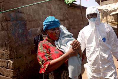Ebola Vaccine Study Set to Begin in Liberia - Mortar shelling kills eight at Eastern Ukraine bus stop, plus more.&nbsp;— Patrice Peck  In a few weeks, a highly anticipated major study of possible Ebola vaccines will start in Liberia, with a smaller study also being scheduled for Sierra Leone, according to U.S. officials. Dr. Anthony Fauci of the National Institute of Health told the AP that up to 27,000 people may ultimately be enrolled in the study, which will &quot;compare two vaccine candidates with dummy shots.” Researchers aim to determine the safety of the shots and whether either of the shots really protects against the deadly virus. &quot;Unless you extinguish the very last case, it's not over 'til it's over,&quot; said Fauci.(Photo: John Moore/Getty Images)