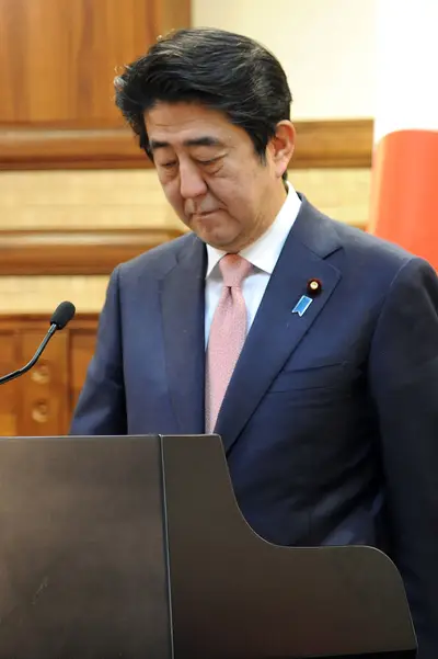 Islamic State Threatens to Kill Japanese Hostages - In a video posted online Tuesday, the Islamic State group demanded a $200 million ransom within 72 hours for the lives of two Japanese hostages, the AP reports. &quot;To the prime minister of Japan...you willingly have volunteered to take part in this crusade,” said a masked militant, standing between the captives, Kenji Goto, 47, and Haruna Yukawa, 42. It is likely the man was referring to Japan’s Prime Minster Shinzo Abe’s recent pledge of monetary aid to the Iraqi government and other countries fighting IS. According to the BBC, Abe, who is currently on an unrelated six-day tour of the Middle East which he is expected to cancel, has said the hostages are his “top priority.&quot;(Photo: Thaer Ghanaim/PPO via Getty Images)