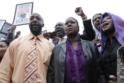 Parents Join the Protest - Trayvon's parents, Tracy Martin and Sybrina Fulton, attended the rally and were greeted with chants of &quot;God bless you!&quot; They told the demonstrators that they would keep fighting for justice for their son, who was unarmed when he was shot and killed by neighborhood watch captain George Zimmerman on Feb. 26.(Photo: AP Photo/Mary Altaffer)