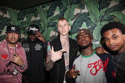 Leaders of the New School - French Montana (l), Machine Gun Kelly (c) and the guys of Travis Porter pose for a pic at the INKED magazine &quot;Skin and Style Issue&quot; Release Party &amp; Machine Gun Kelly's Half Naked &amp; Almost Famous EP release held at Hiro Ballroom at the Maritime Hotel in New York City. (Photo: Johnny Nunez/WireImage)
