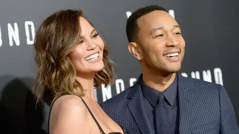 Chrissy Teigen (L) and actor/singer/executive producer John Legend attend WGN America's "Underground" Season Two Premiere Screening at Regency Village Theatre on March 1, 2017 in Westwood, California. 