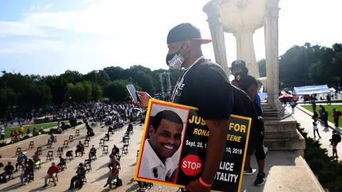 WASHINGTON, DC - AUGUST 28: Sean Green, brother of Ronald Greene, listens to speakers at the Lincoln Memorial during the March on Washington August 28, 2020 in Washington, DC. Ronald Greene died in police custody following a high-speed chase in Louisiana in 2019. Today marks the 57th anniversary of Rev. Martin Luther King Jr.'s "I Have A Dream" speech at the same location. (Photo by Michael M. Santiago/Getty Images)