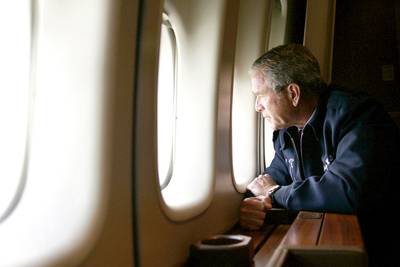President Bush Views Damage&nbsp; - Here former President&nbsp;George W. Bush&nbsp;surveys from Air Force One the damage left by Hurricane Katrina on Aug. 31, 2005. Air Force One descended to about 5,000 feet to allow Bush to view the destruction in New Orleans; Gulfport and Biloxi in Mississippi; Mobile, Alabama; and other cities before landing in Washington, D.C.&nbsp;(Photo: Jim Watson/AFP/Getty Images)