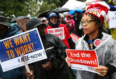 /content/dam/betcom/images/2013/10/National-10-01-10-15/101113-national-government-shutdown-protest-jobs-signs.jpg