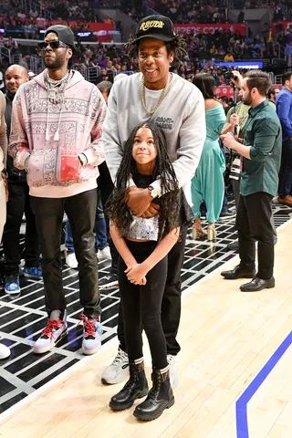 Jay-Z And Daughter, Blue Ivy - Jay-Z and Blue Ivy's daddy-daughter date on Sunday (Mar. 8) left the internet buzzing. Whether you couldn't stop swooning over the duo's unbreakable bond or you were left admiring the 8-year-old's stylish braids, the courtside moment at the Clippers vs Lakers game filled our timelines with a sweet moment to remember.&nbsp;Can we have a moment to admire Blue’s custom denim jacket with the words “Blue Is My Name” written on the back, along with her $950 Fendi boots? A mood.(Photo: Allen Berezovsky/Getty Images) (Photo: Allen Berezovsky/Getty Images)