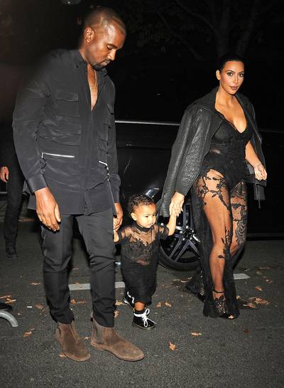 The Wests - Yeah, we've seen the Kim Kardashian and Kanye West couples costumes in the past, but now that North is hitting fashion shows and matching Kim?s attire, it's time for the West family costume. The Wests love anything black and designer, but unless you have a Givenchy gown just lying around, a knockoff will do. Look for matching mommy-and-me lace dresses. Your man just needs to rock a black suit sans the undershirt since, well, that's ?Ye's thing.   (Photo: Ralph,PacificCoastNews)