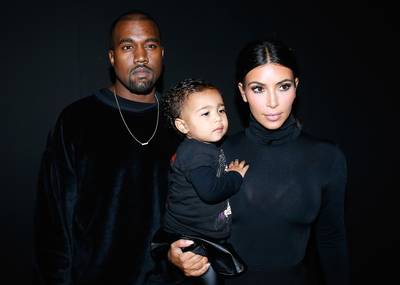 The Kardashian-West Klan - Kanye West, Kim Kardashian and their daughter,&nbsp;North West, wear coordinating black ensembles at the Balenciaga show as part of the Paris Fashion Week Womenswear Spring/Summer 2015 in Paris. (Photo: Bertrand Rindoff Petroff/French Select/Getty Images)