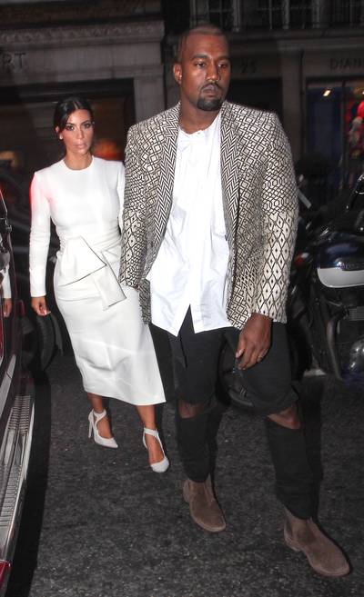 Nobody Smiling - Kim Kardashian and Kanye West&nbsp;put on their serious faces as they arrive to dinner at Hakkasan restaurant in Mayfair, London.(Photo: WENN.com)