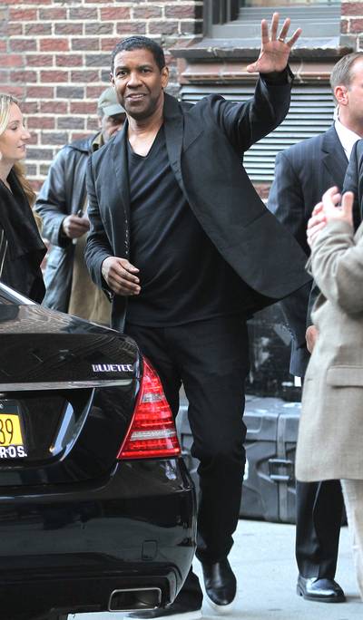 Leading Man - Denzel Washington waves to fans as he makes his way out of the Late Show With David Letterman in NYC, where he promoted his new film, The Equalizer.(Photo: Blayze / Splash News)
