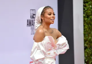 Eva Marcille - Eva Marcille&nbsp;protected her mane under a silky white headwrap.&nbsp; (Photo by Paras Griffin/Getty Images for BET)