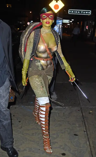 She's Baaaack! - Rihanna struts her stuff while dressed as one-fourth of the Teenage Mutant Ninja Turtles on Halloween while partying with her girls in NYC. But, more important, all is right with the world since the pop princess has returned to Instagram with her original IG,&nbsp;@badgalriri.(Photo: TS, PacificCoastNews)