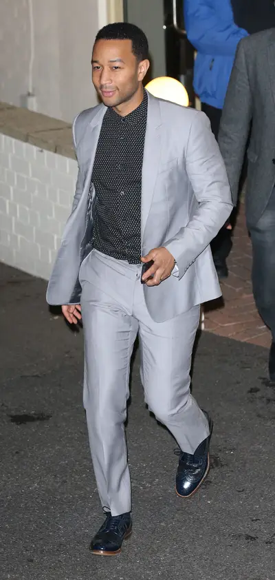 Sharp Dressed Man - John Legend&nbsp;exits the Spring Studios in London, where he filmed&nbsp;The X Factor&nbsp;wearing a tailored gray suit with navy oxfords and a printed dress shirt.(Photo: Splash News)
