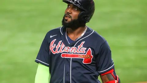 ARLINGTON, TEXAS - OCTOBER 18:  Marcell Ozuna #20 of the Atlanta Braves flies out against the Los Angeles Dodgers during the third inning in Game Seven of the National League Championship Series at Globe Life Field on October 18, 2020 in Arlington, Texas. (Photo by Ronald Martinez/Getty Images)