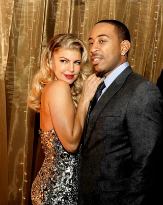 Welcome to Hollywood\r - Singer Fergie gives old Hollywood glamour as she poses with rapper/actor Chris &quot;Ludacris&quot; Bridges at the after-party for the premiere of the holiday film New Year's Eve at Hollywood and Highland in Hollywood. (Photo: Kevin Winter/Getty Images)