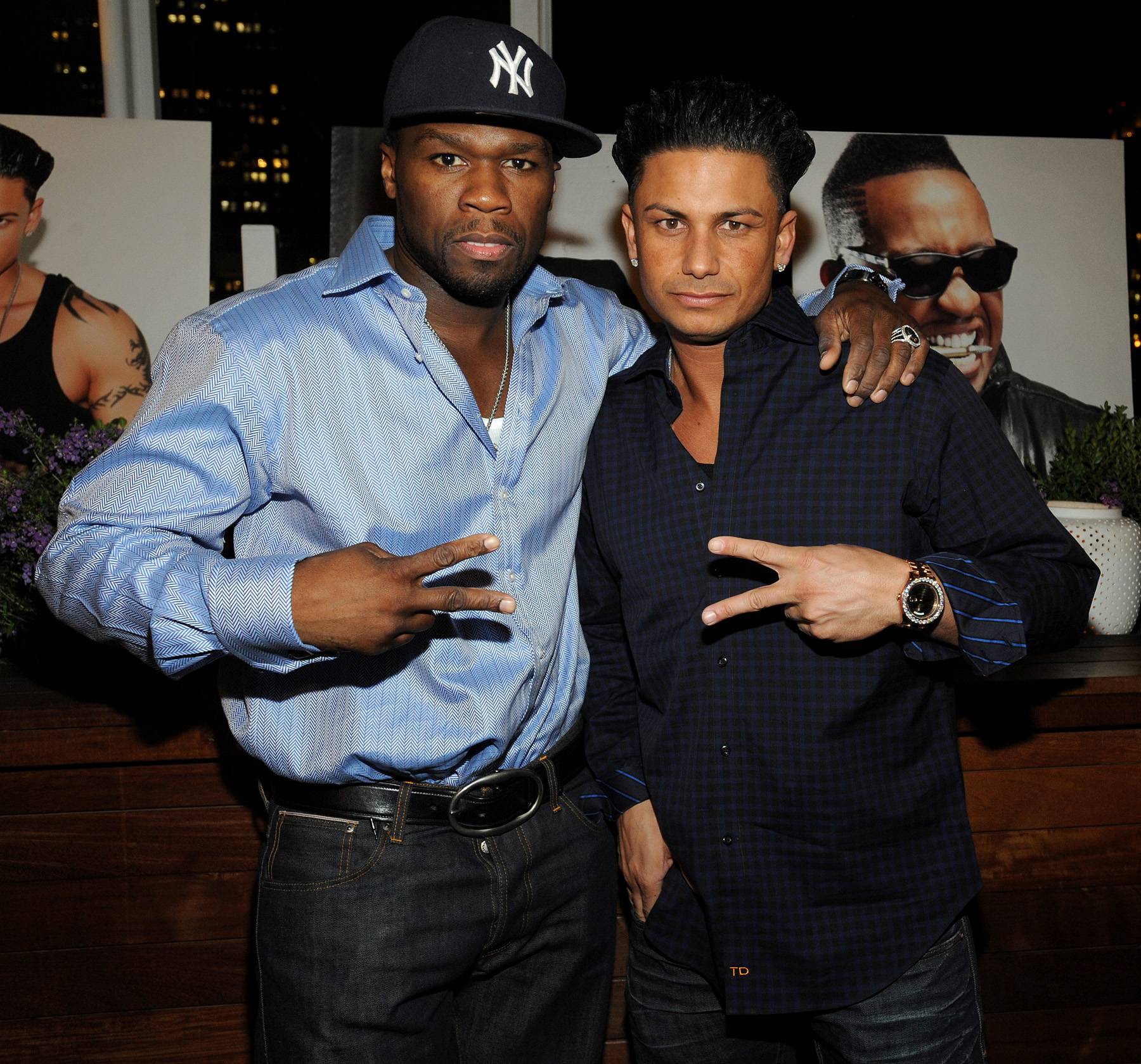 Real G's\r - 50 Cent and Pauly D chuck the deuce to the cameras on the red carpet of the G-Note Music party at the Strand Hotel in New York City. A rumored partnership between the rap mogul and reality star has been circulating since the spring, but it wasn't until yesterday that the pair confirmed DJ Pauly D's signing via Twitter.&nbsp; (Photo: Brad Barket/PictureGroup)