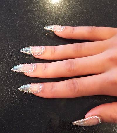 Blac Chyna - Diamonds are this girl’s best friend. Her studded mani, set off with spiked tips, is rich. Very rich.  (Photo: Blac Chyna via Instagram)