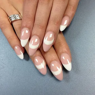 Helen Castillo - The fashion designer and Project Runway alum puts a twist on the classic French mani, adding in a few accent nails to keep it interesting.(Photo: Helen Castillo via Instagram)