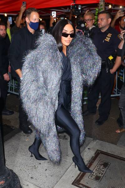 NYC Vibes&nbsp; - Kim Kardashian was spotted out in NYC heading to dinner with the cast of SNL. The business mogul wore an all black Balenciaga look with a shaggy metallic Balenciaga coat that costs $12K. she is serving in this look! (Photo: Backgrid)