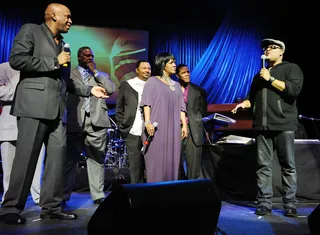 Score! - Backed by the NFL player's gospel choir (which he directs), Donnie, CeCe Winans and Israel Houghton perform at the 2010 Super Bowl Gospel Celebration in Miami. (Photo by Rick Diamond/Getty Images for Super Bowl Gospel Celebration 2010)