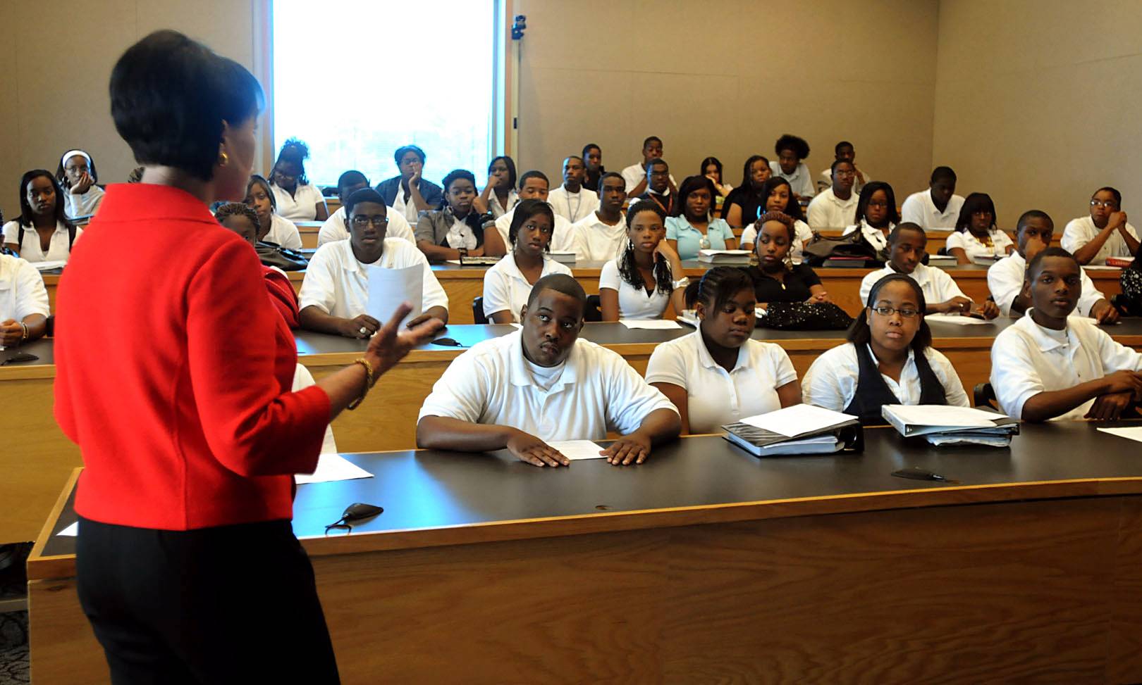 Education - Many cities and states across the nation have already made big cuts at all levels of their public school systems. Given the achievement disparities between African-American and white students, and the critical need to engage minority students in the science, technology, engineering and math fields, a default would exacerbate the achievement level gaps.(Photo: Birmingham News/Landov)