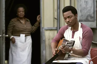 Christopher Jefferson's character JT Tucker plays a song behind Ma Mabel's cafe. - (Photo: Jace Downs/BET)