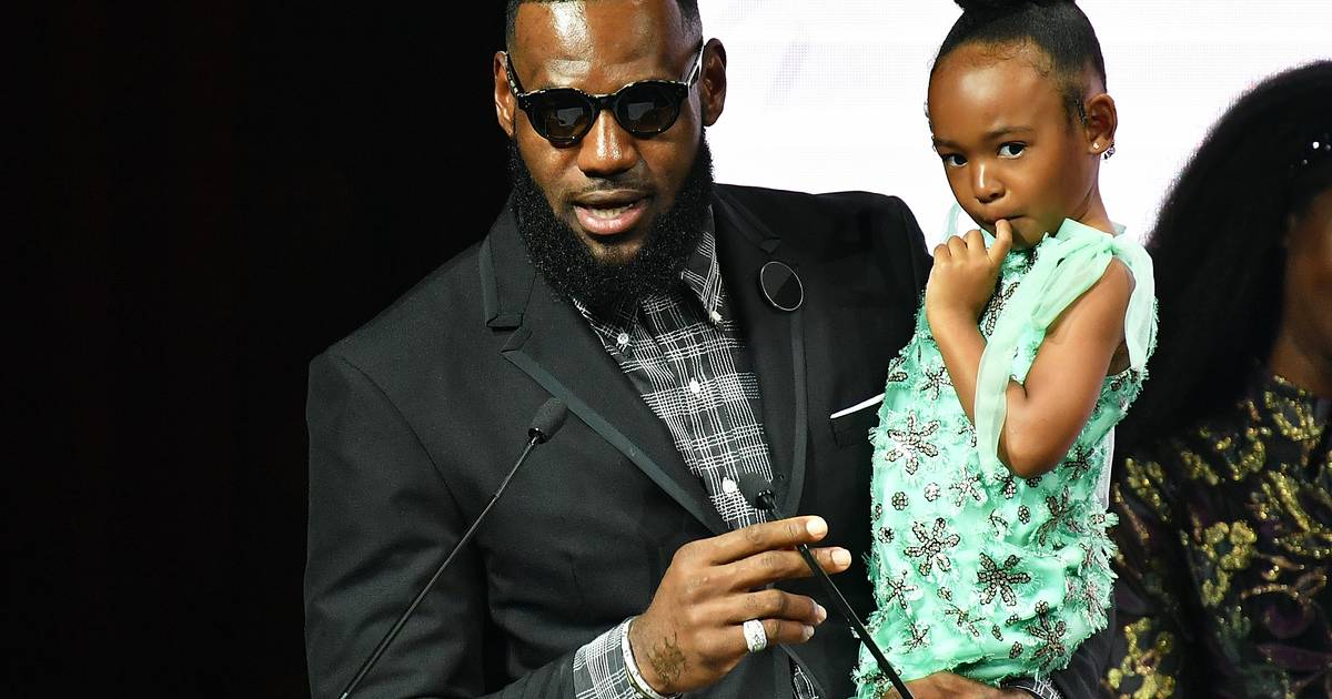 LeBron James plays the role of doting dad as he and wife Savannah