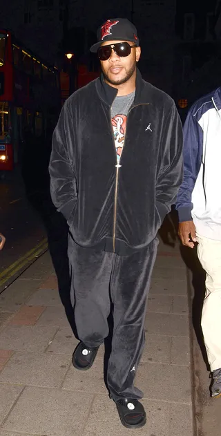 Laying Low - Flo Rida in London leaving the Mayfair Hotel in a velour tracksuit with matching house shoes. The rapper has been taking it easy since his DUI arrest in June. (Photo: Fame Pictures)