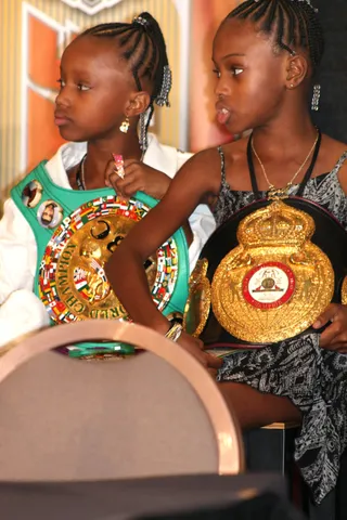 Khan-Judah - Zab Judah's daughters holding their father's championship belts following the fight.&nbsp;(Photo: Marcus Vanderberg)