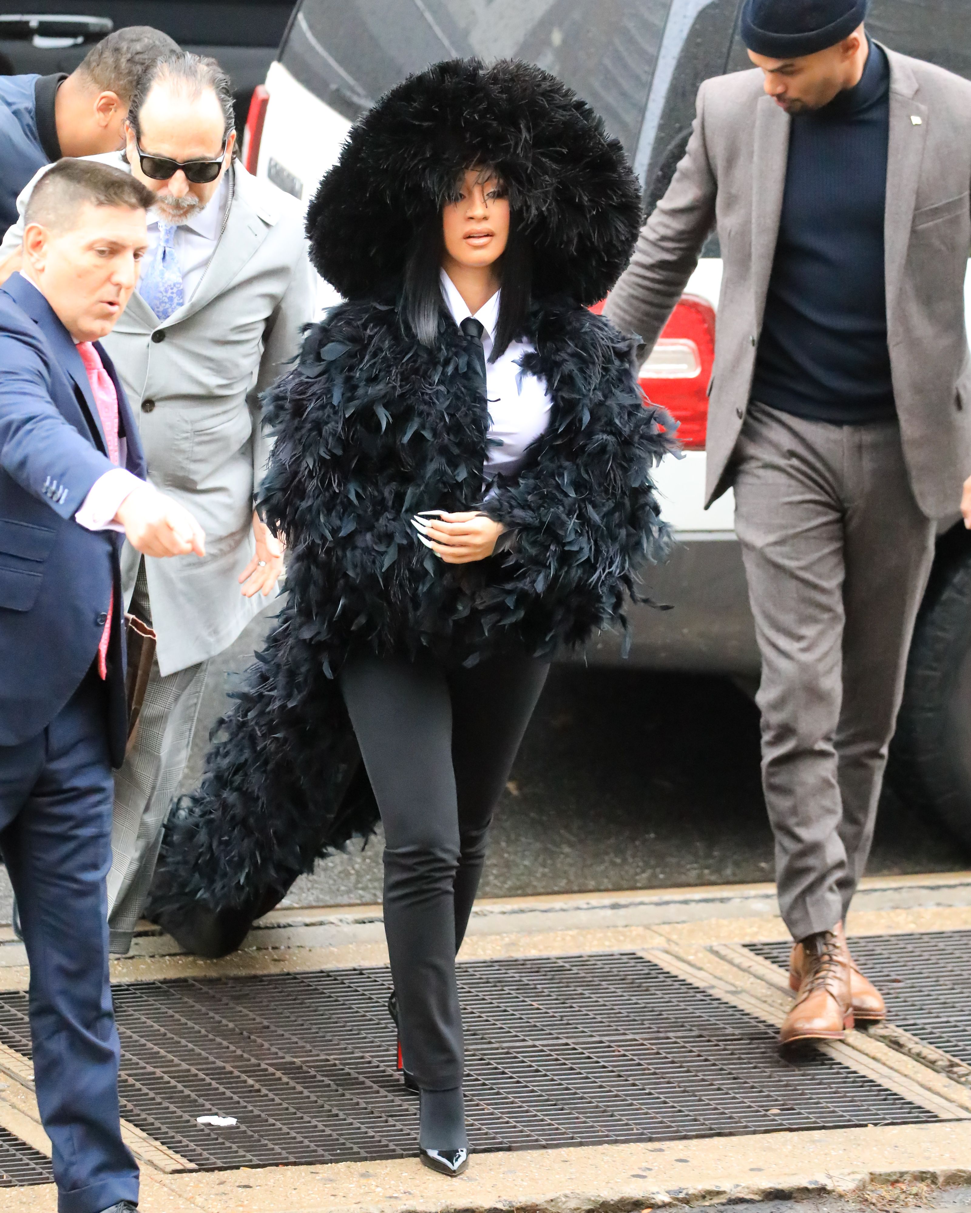 A Queen In Queens - Styled by Kollin Carter, Cardi arrived at court in Queens, NY on Tuesday (Dec. 10) dressed to the nines in ADRIENNE LANDAU's Queen's fur coat designed by Saulo Villela. Talk about making a grand entrance! (Photo: Alessio Botticelli/GC Images)