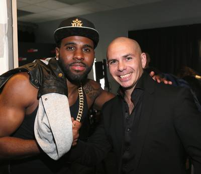 Backstage Pass - Recording artists Jason Derulo and Pitbull show some brotherly love at the 106.1 KISS FM 2013 Jingle Ball at American Airlines Center in Dallas. (Photo: Gary Miller/Getty Images for Clear Channel)