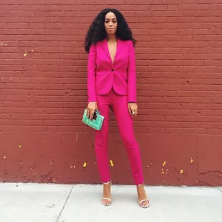 Solange @saintrecords - Pretty in pink took on a new meaning when Solange slayed in this fuchsia pantsuit with a mint green clutch and gold heels to match!   (Photo: Solange Knowles via Instagram)